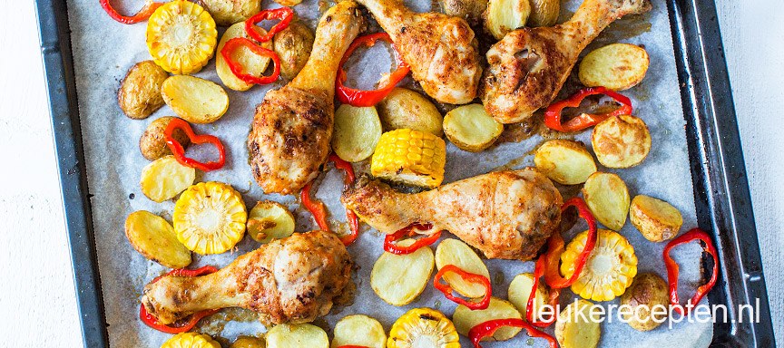 Kipdrumsticks met mais van de bakplaat